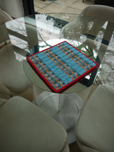 Load image into Gallery viewer, Blue, Grey, White and Orange striped Trivet